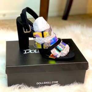 Dolls Kill black strapped suede hologram heels.